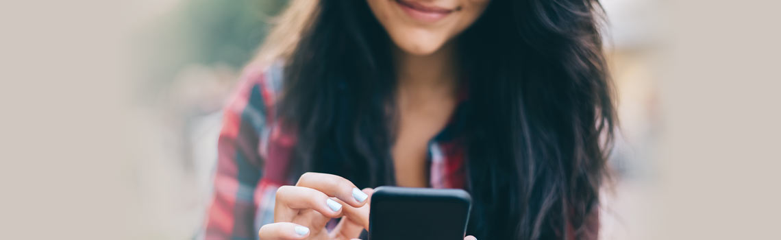 Young woman texting